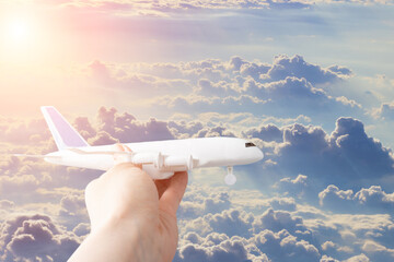 airline tickets booking, plane in the sky in hand, charter flights, low-cost airlines, air communication