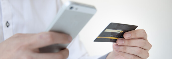 Businessman use mobile phones to register for security Online with a credit card to buy products online through application, Online shopping or Internet technology concept.