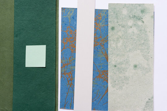 set of paper pieces and a squarish paper tile