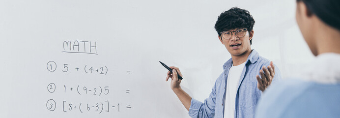 Teacher taught the book with a bright smile, Students raised their hands to answer questions with courage, Mathematics education in a high school or university classroom.