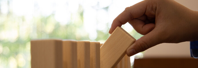 Strategies and risks of wooden games, Close-up of business people gambling with investment risk, Business people play wooden games to simulate planning and strategy for managing business risk.