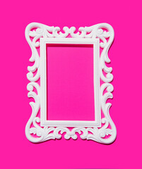 White picture frame empty space in the middle, neon pink background, hot summer trend.