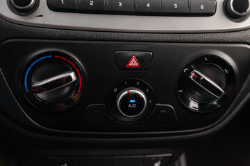 Air conditioning controls on the car dashboard. Close up car ventilation system, details of controls of modern car