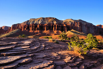 Capitol Reef National Park, Utah, USA. Late day shadows across the red rock landscape near sunset.