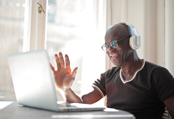 portrait of black adult man during a video call