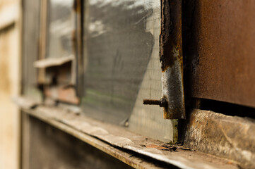 Fototapeta na wymiar Closeup of rusty industrial building detail covered in dirt