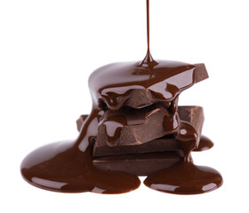 Chocolate pieces stack and chocolate syrup isolated on white background. Close up.