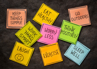healthy lifestyle and wellbeing concept - a set of inspirational reminder notes against black...