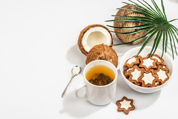 Gluten-free and lactose-free coconut cookies. Homemade healthy pastries, green tea, sunny morning