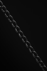 Nickel plated metal chain black background.