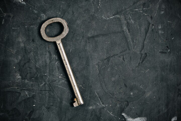 Old, retro vintage key dark background.