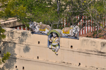 Statue of one of the Hindu gods In the courtyard of the temple in Madurai, Tamil Nadu, India