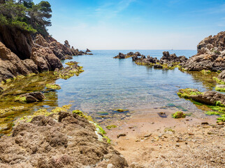 View of secluded cove with emerald green water near Palamos, Catalonia