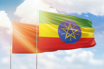 Sunny blue sky and flags of ethiopia and morocco