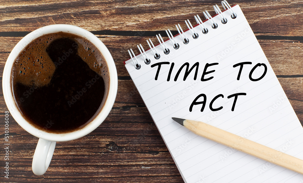Aufkleber time to act text on notebook with coffee on wooden background