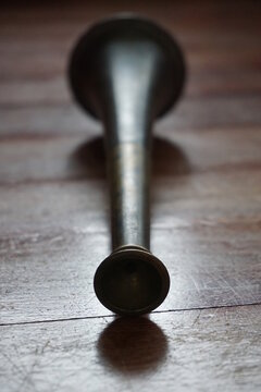 antique brass ships horn on wooden background