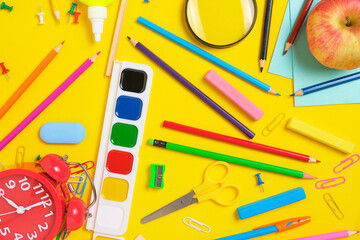 School supplies and stationery yellow background.Preparing child for school.