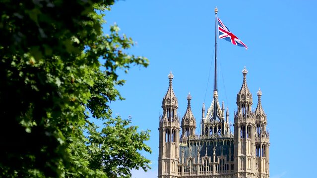 The footage of Parliament Tower and flying Union Jack in London on a summer day
