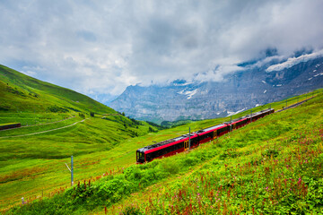 Fototapeta na wymiar Train in Lauterbrunnen valley, Switzerland