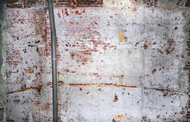 Dilapidated building facade with damaged plaster.