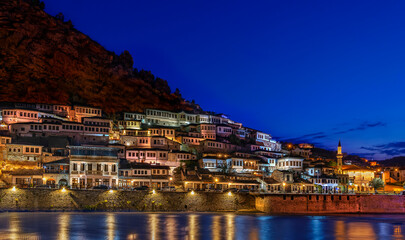 Skyline of the old city of Berat with its ancient houses, at the dusk in Albania. - obrazy, fototapety, plakaty