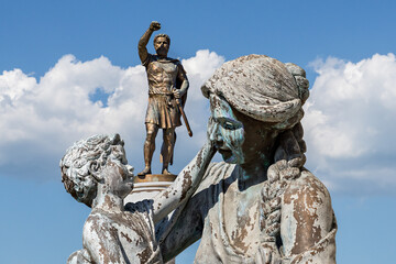 Statues of baby Alexander The Great, his mother Olympias and his father King Philip in the city square of Skopje, North Macedonia - obrazy, fototapety, plakaty