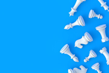 Strewn chess figures on blue background. Table games. International tournament. Hobby and leisure. Top view. Copy space. 3d render