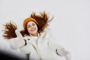 Naklejka premium young woman smile winter weather snow recreation fun fresh air