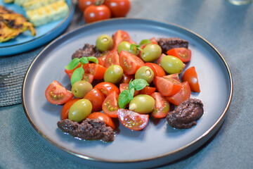 Salad with Green Olives and Cherry Tomatoes.