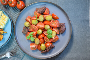 Salad with Green Olives and Cherry Tomatoes.