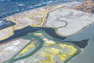 scenic aerial view to fields and shore of San Francisco with marshland of the land reclamation...