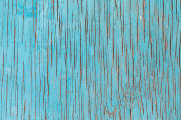 background of old wooden wall with blue cracked paint