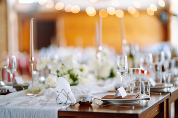 Banquet table with wedding and festive serving. Wedding, birthday, party, event concept.