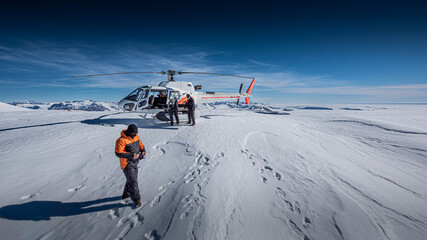 Scientists install experiments in dry valleys, Antarctica, via helicopter - obrazy, fototapety, plakaty