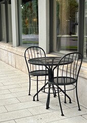 Fototapeta na wymiar Outdoor wrought iron seating for a bistro