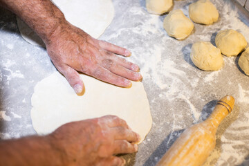 Flour dough and men's hands