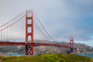 vew to Golden Gate Bridge in fog in early morning light