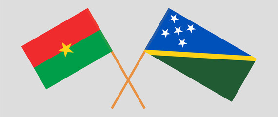 Crossed flags of Burkina Faso and Solomon Islands. Official colors. Correct proportion
