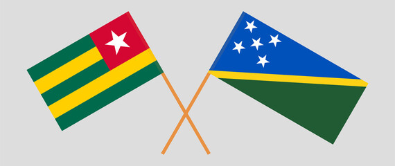 Crossed flags of Togo and Solomon Islands. Official colors. Correct proportion