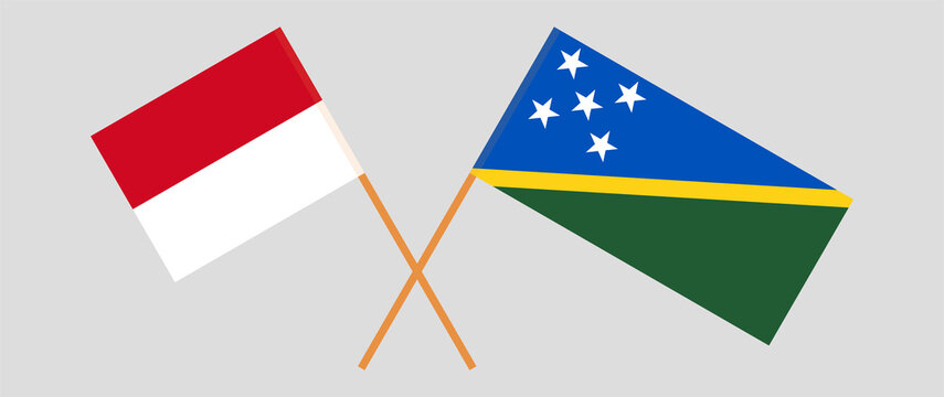Crossed flags of Monaco and Solomon Islands. Official colors. Correct proportion