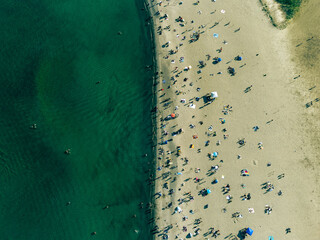 Toronto woodbine beach drone shot with a top view of the beach. The people enjoying summer on the beach.