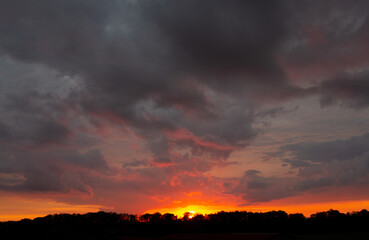 Beautiful sunset in unusual pastel real colors. Sahara red sand to Central Europe brought an exceptional color at sunset. The scene comes from in June in Prague. Version the second evening.