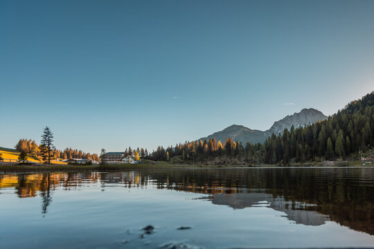Early morning on the lake of Pramollo, Italy, just close to Nassfeld in Austria. Beautiful mountain lake in clean nature.