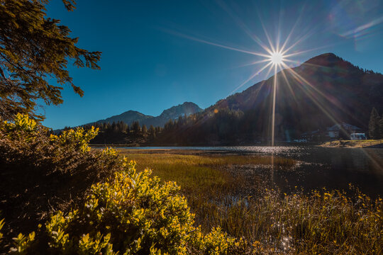 Early morning on the lake of Pramollo, Italy, just close to Nassfeld in Austria. Beautiful mountain lake in clean nature.