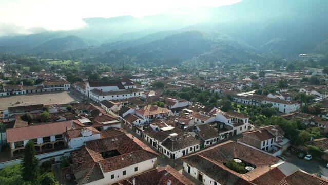 Aerial view of houses of the same style with mountains in the background in the city of Villa de Leyva. Colombia.
