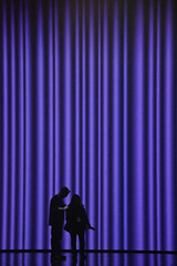 silhouette of a couple on the stage