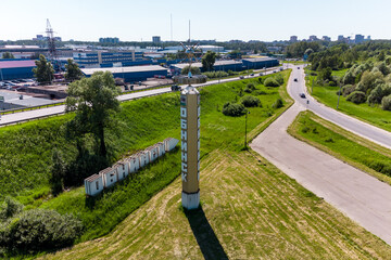 Stele and pointer at the entrance to the city of Obninsk, aerial view. Obninsk, Russia - June 2021