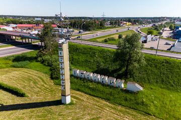 Stele and pointer at the entrance to the city of Obninsk, aerial view. Obninsk, Russia - June 2021