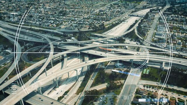 Aerial shot of large multilevel highway interchange in suburb. Augmented reality showing additional info for targeted objects