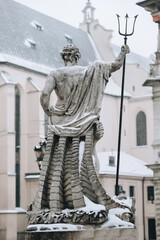 Fountain of Neptune in the historical center of the city. Lviv, Ukraine. View from the back. © shchus
